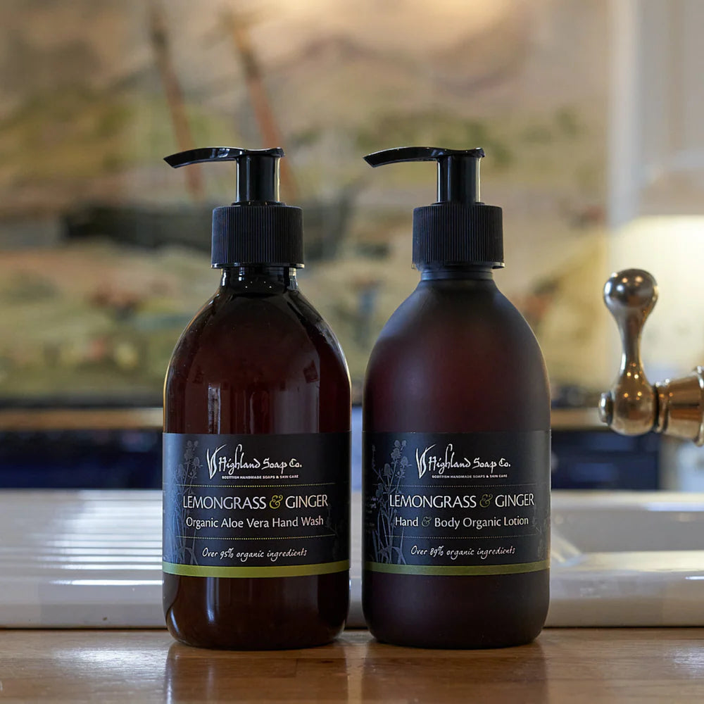 Two bottles of Lemongrass & Ginger Hand Wash and Lotion on a bathroom counter