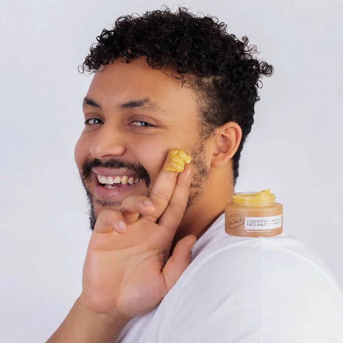 Man wearing UpCircle Beauty Cleansing Face Balm with Vitamin E