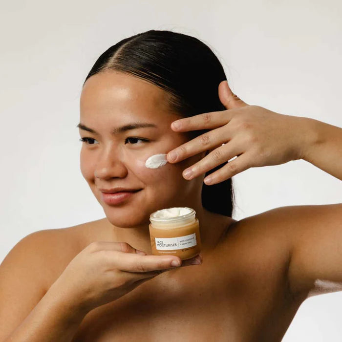 UpCircle Beauty Face Moisturiser with Vitamin E east asian lady wearing product