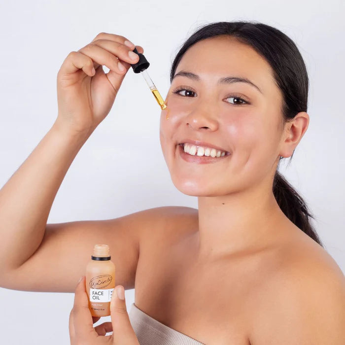 White person using UpCircle Beauty Organic Face Oil with Coffee Extract