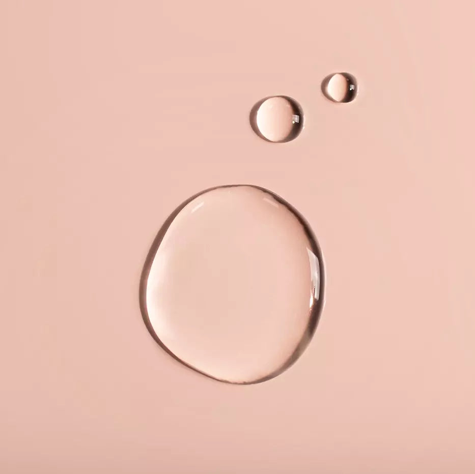 Three droplet swatches on a pink background