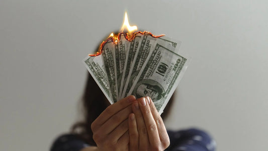 Woman setting fire to money because of bad skincare
