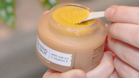 Person with skincare spatula using UpCircle Cleansing Balm