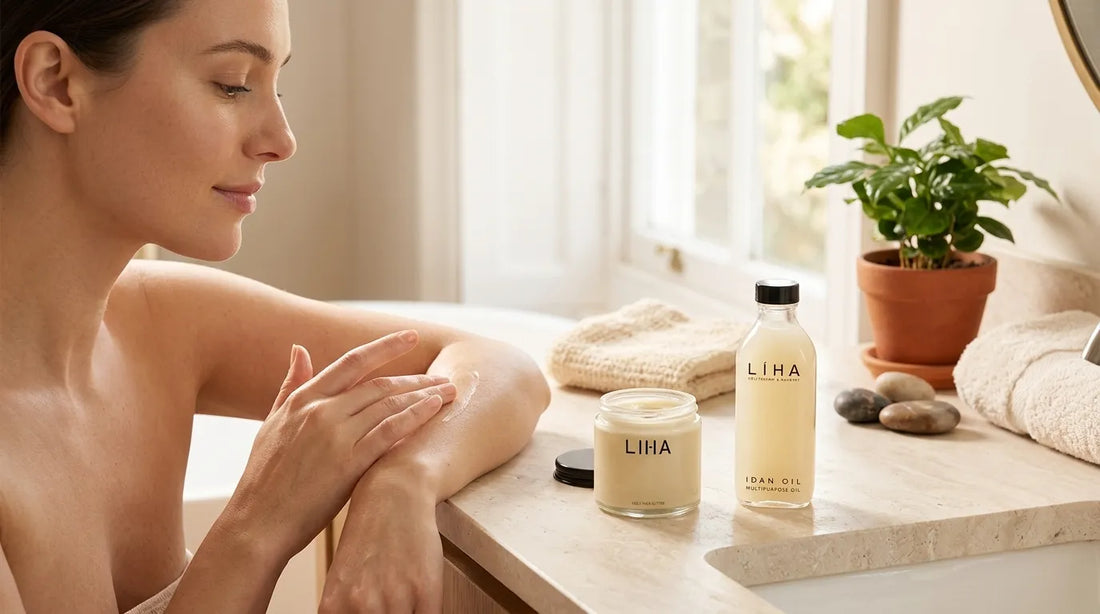 Woman putting on LIHA Beauty Shea Butter Gold in her bathroom