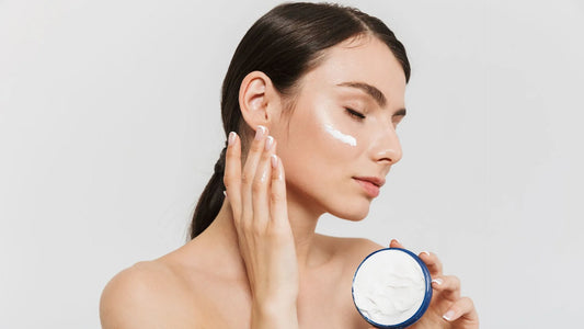 Woman layering her skincare