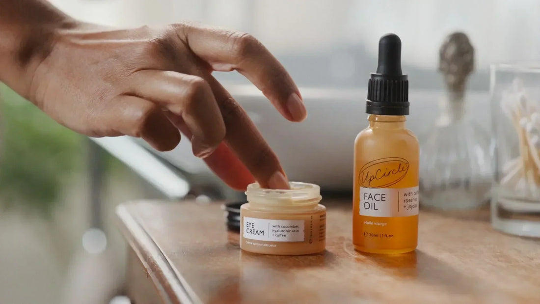 Person applying UpCircle Beauty Eye Cream