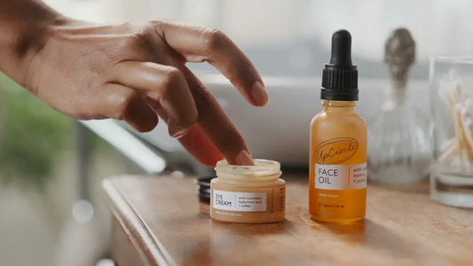 Person applying UpCircle Beauty Eye Cream