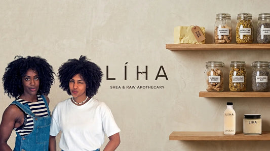 Both LIHA Beauty founders in front of logo backdrop with ingredients