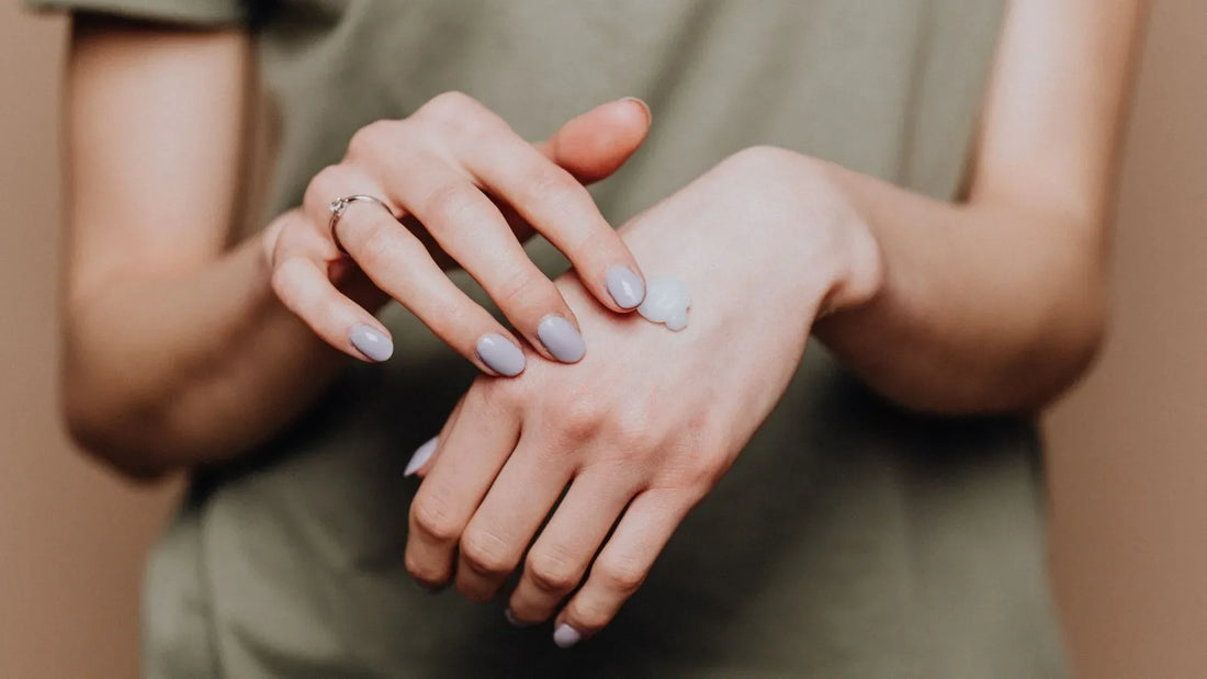 Woman putting on cream for her inverse psoriasis