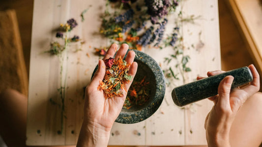 Woman holding herbs for ancient skincare