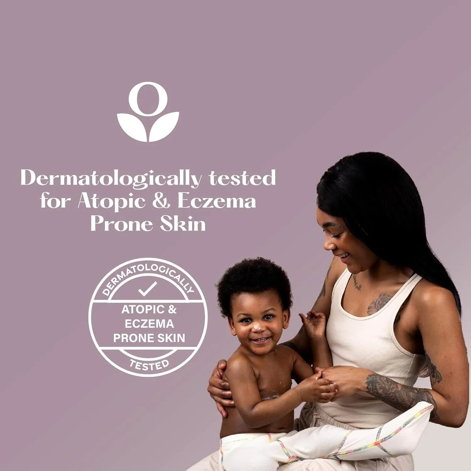 Balmonds Super 7 Serum - 30ml model shot of woman holding a child with text about dermatological testing for atopic and eczema-prone skin on a purple background
