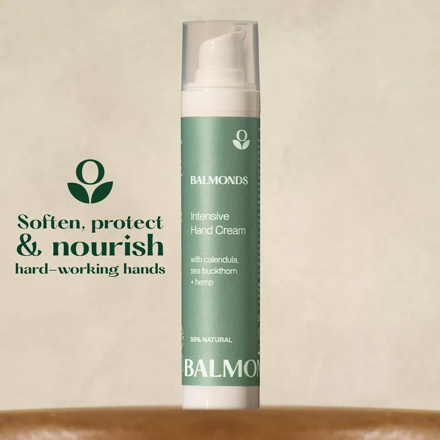 Balmonds Intensive Hand Cream - 50ml product shot with green hand cream bottle with Balmonds branding on a beige background