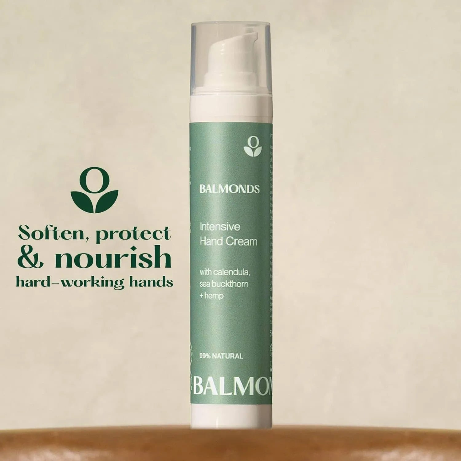 Balmonds Intensive Hand Cream - 50ml product shot with green hand cream bottle with Balmonds branding on a beige background
