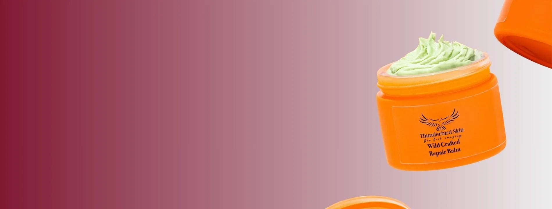 Orange Thunderbird Rescue Cream on burgundy background