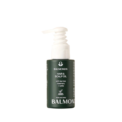 Balmonds hair and scalp oil bottle on a beige background