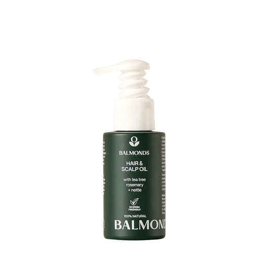 Balmonds hair and scalp oil bottle on a beige background