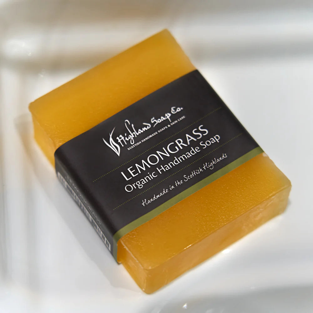 Bar of Lemongrass & Ginger Soap with a black label on a white background