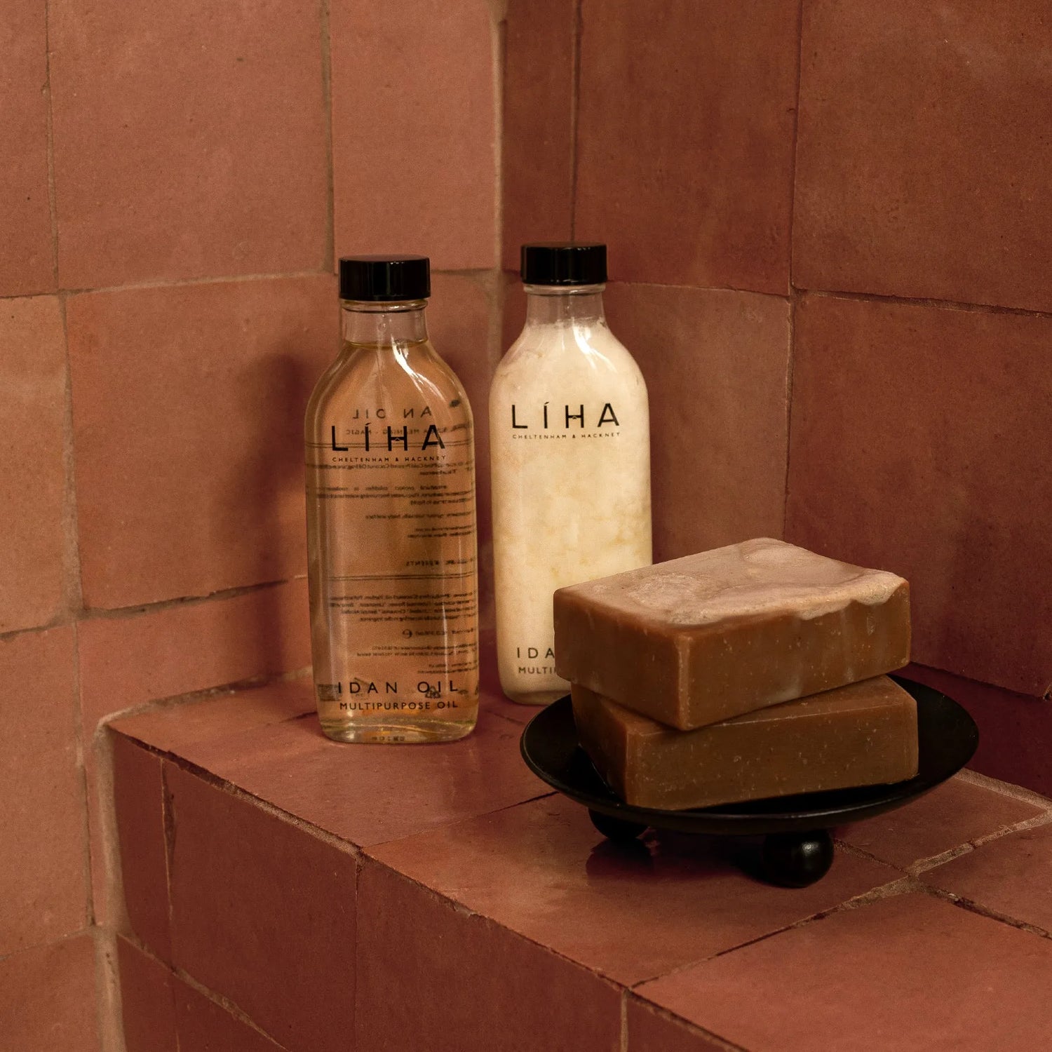 LIHA products including bottles and soap on a tiled shelf.