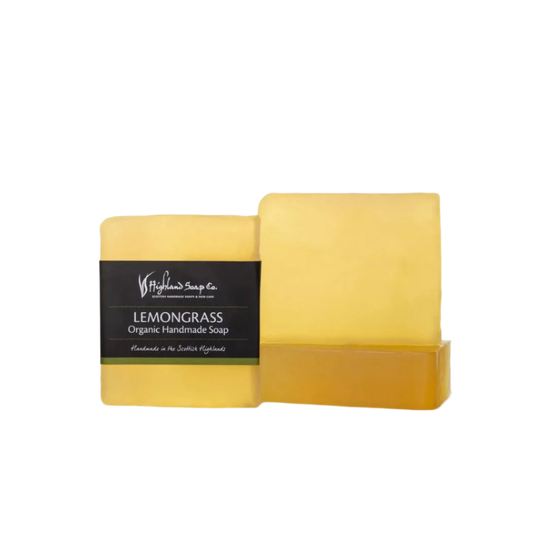Two yellow bars of Lemongrass & Ginger Soap with a black label on a white background