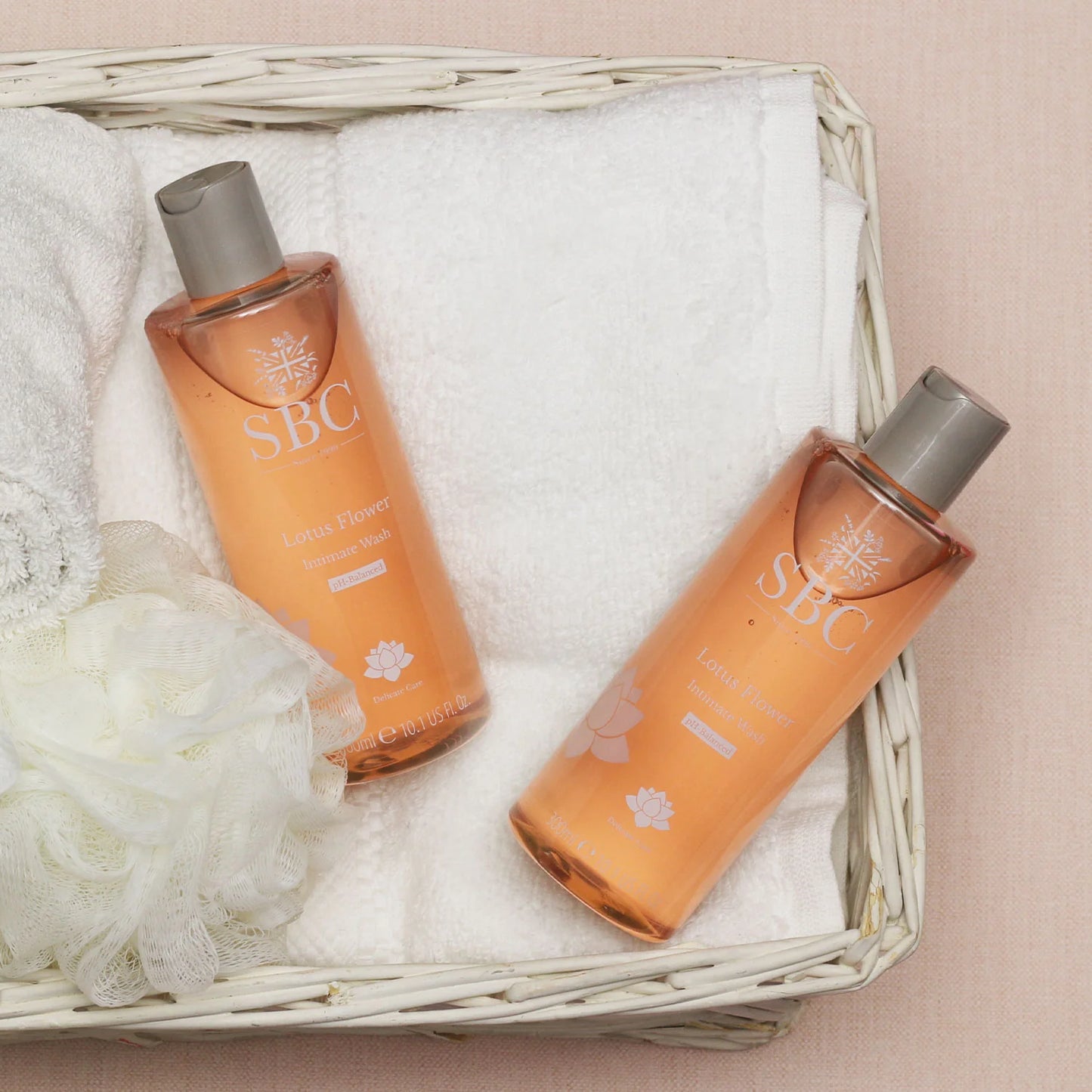 Lotus Flower Intimate Wash lifestyle shot with 2 lotus flower products