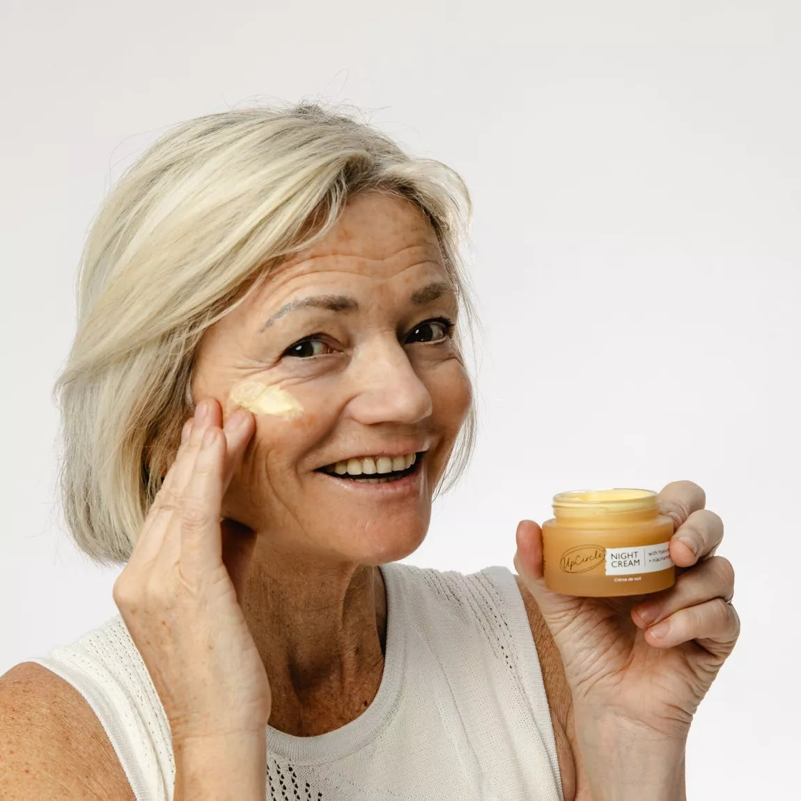 Older white lady wearing UpCircle Beauty Night Cream with Hyaluronic Acid + Niacinamide