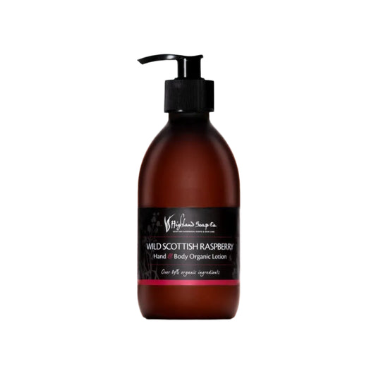 Brown bottle of Wild Scottish Raspberry hand and body organic lotion with a pump on a white background